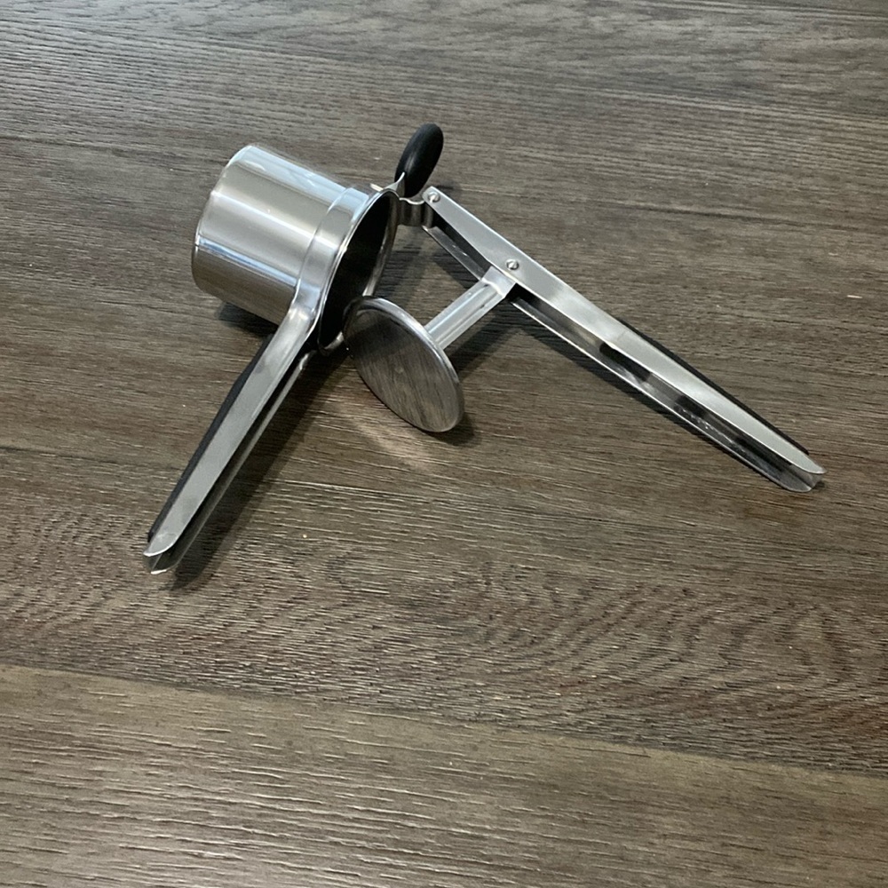 Stainless steel potato masher